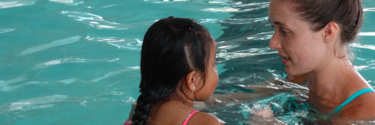 girl taking swim lessons
